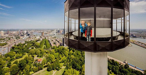 in top of the euromast rotterdam a father and son are enjoying view