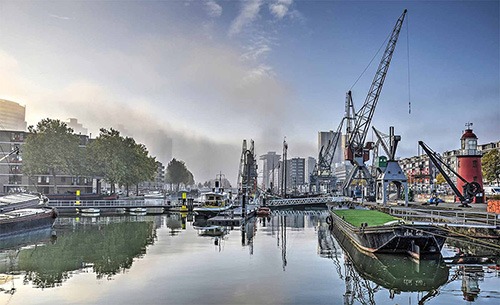 cranes, lighthouse and historical vessels at maritime museum rotterdam
