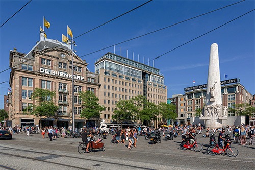 de bijenkorf and krasnapolsky at dam square with national monument amsterdam
