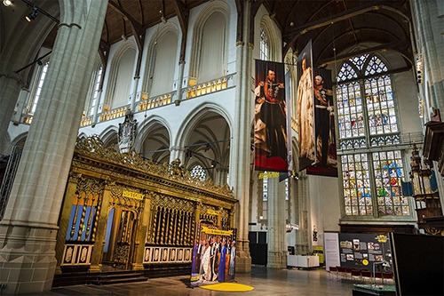 interior of the new church amsterdam with stained glass windows and pictures of the royal weddings