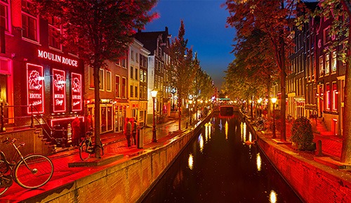 one of the most beautiful Amsterdam canals flooded by red light