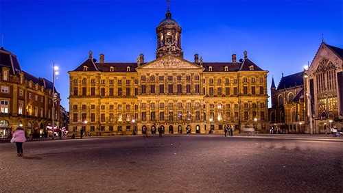 royal palace amsterdam at a blue night empty dam square